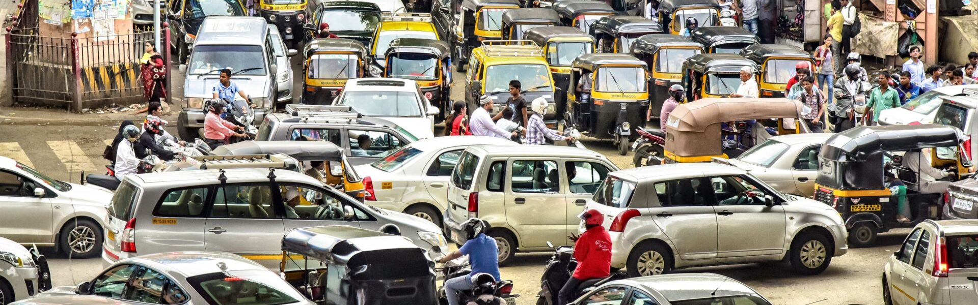Busy street in india full of cars and people