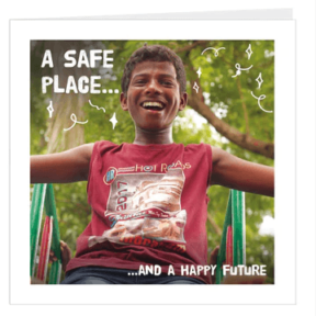 A virtual card with a young indian boy smiling for the camera. Text reads: A safe place...and a happy future.