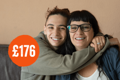 women being hugged by teenager boy