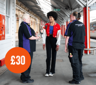A teenage girl stood with two station workers. Orange circle with £30 inside.
