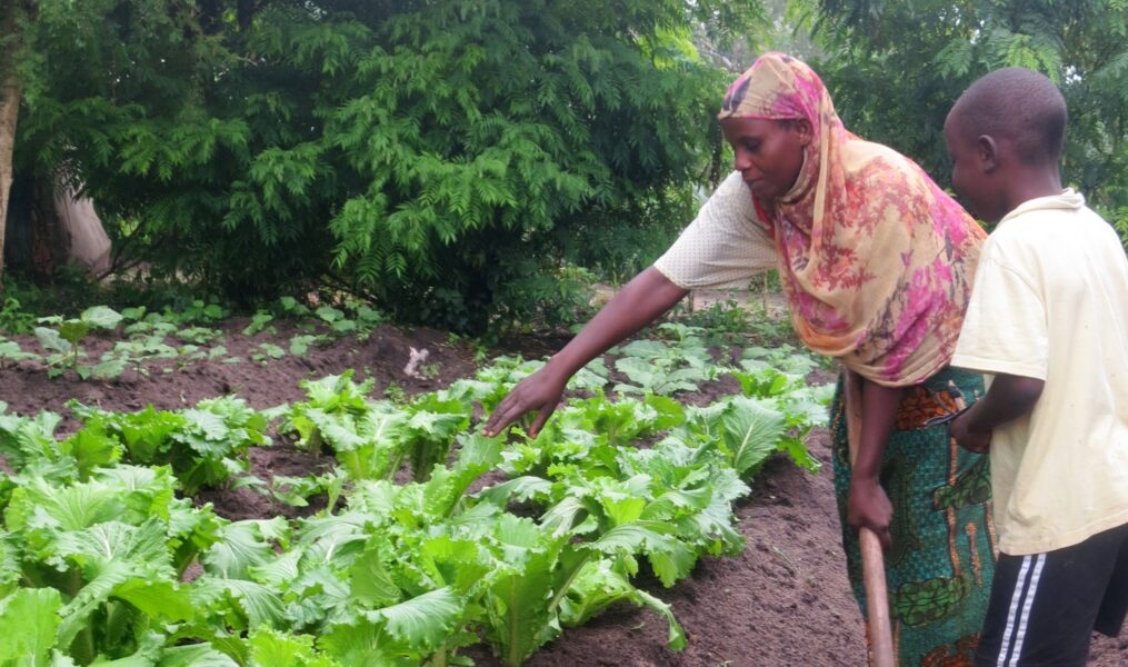 Rosa and her child gardening