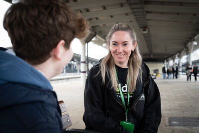 Railway Children worker speaking to young person smiling