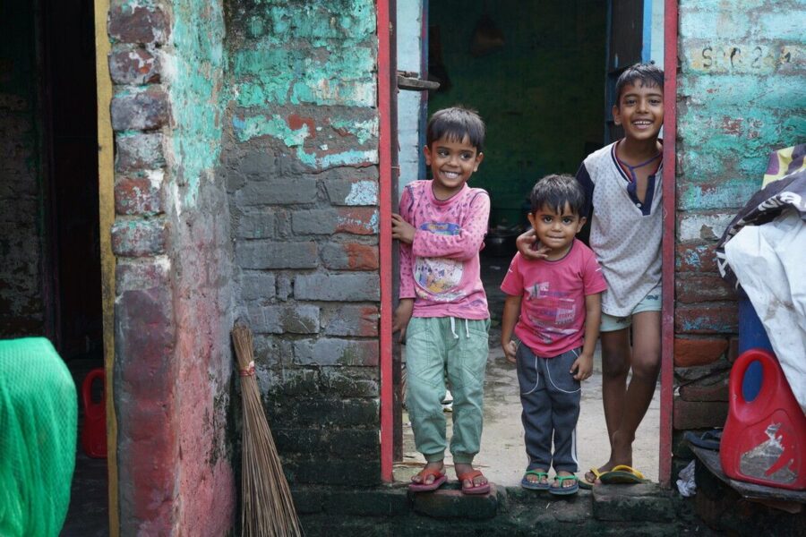 Small children in India smiling at the camera