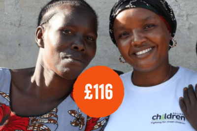 Two females in Tanzania looking at camera and smiling