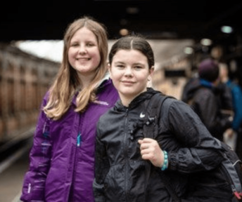 UK children smiling at camera