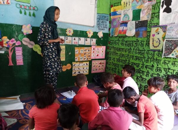 community champion in India supporting vulnerable young children.