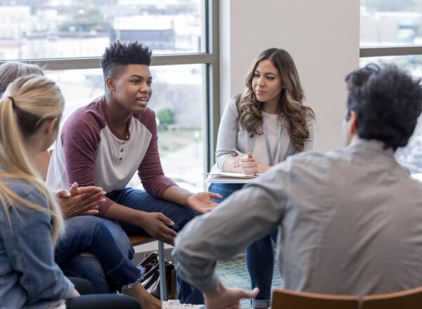 group of teenagers in a group discussion