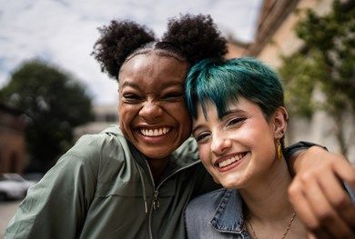 Teenage girls smiling for the camera.