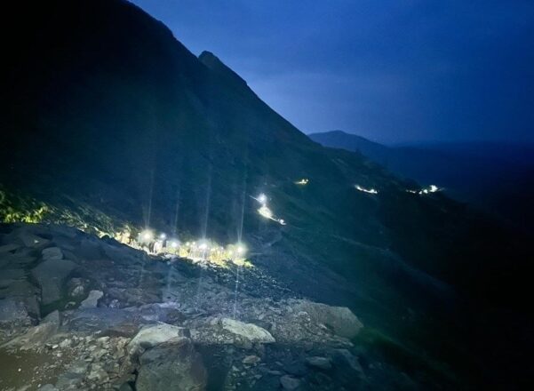 image of three peaks event at night.