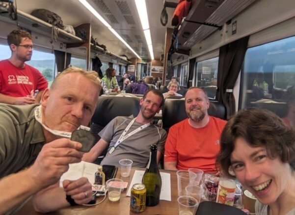 Matthew Durbin and his team on a train.