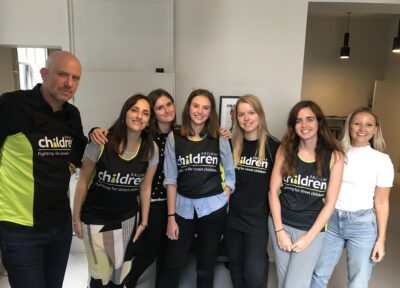 Group of people wearing railway children t-shirts.