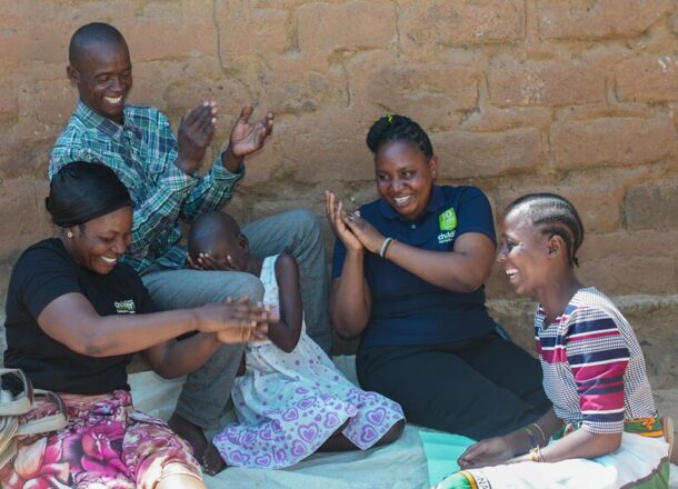 Railway Children workers doing an activity with a family.
