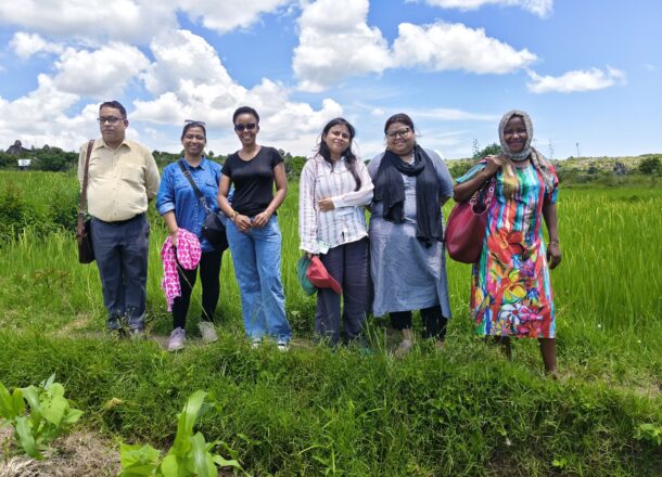 People posing in field in tanzania
