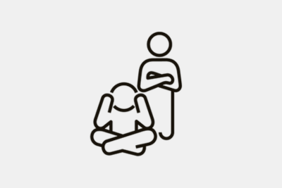 An icon showing a child sat on the floor with their hands over their ears with an adult stood behind them with their arms folded.