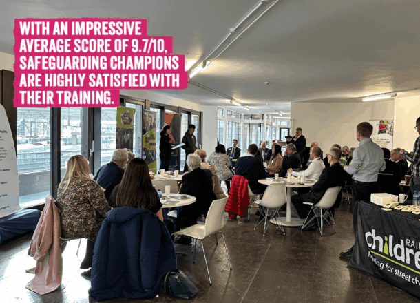 A conference room with people sat at tables listening to speakers with text on image: With an impressive average score of 9.7/10, safeguarding champions are highly satisfied with their training.