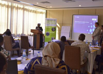 A speaker facing a room of people participating in the training
