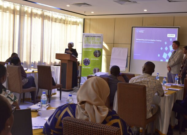 A speaker facing a room of people participating in the training