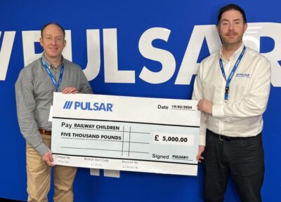 Pulsar representatives presenting a £5,000 donation cheque to Railway Children.