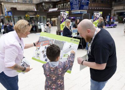 Interactive safeguarding activity run by Railway Children in a railway station concourse.
