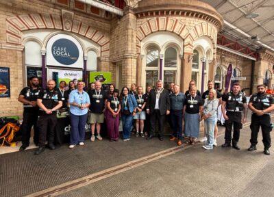 Railway Children staff with rail industry colleagues celebrating the Days of Action at Crewe Station.