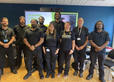 Rail industry colleagues with a member of the Railway Children training team.
