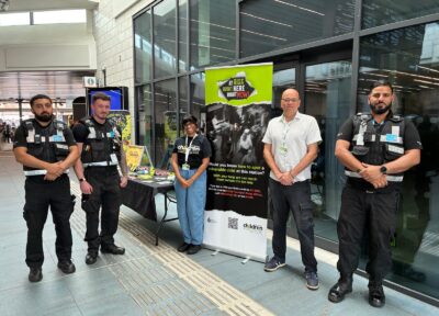 Rail security staff with some of the Railway Children team in a West Midlands train station as part of the Days of Action campaign.