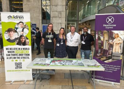 One of Railway Children's community engagement workers with staff from Heathrow Express at an awareness raising event.
