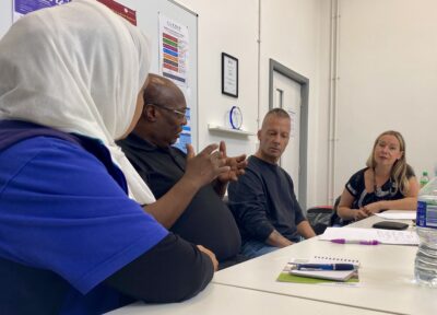 A group of rail industry staff having a discussion during a Railway Children safeguarding training session.