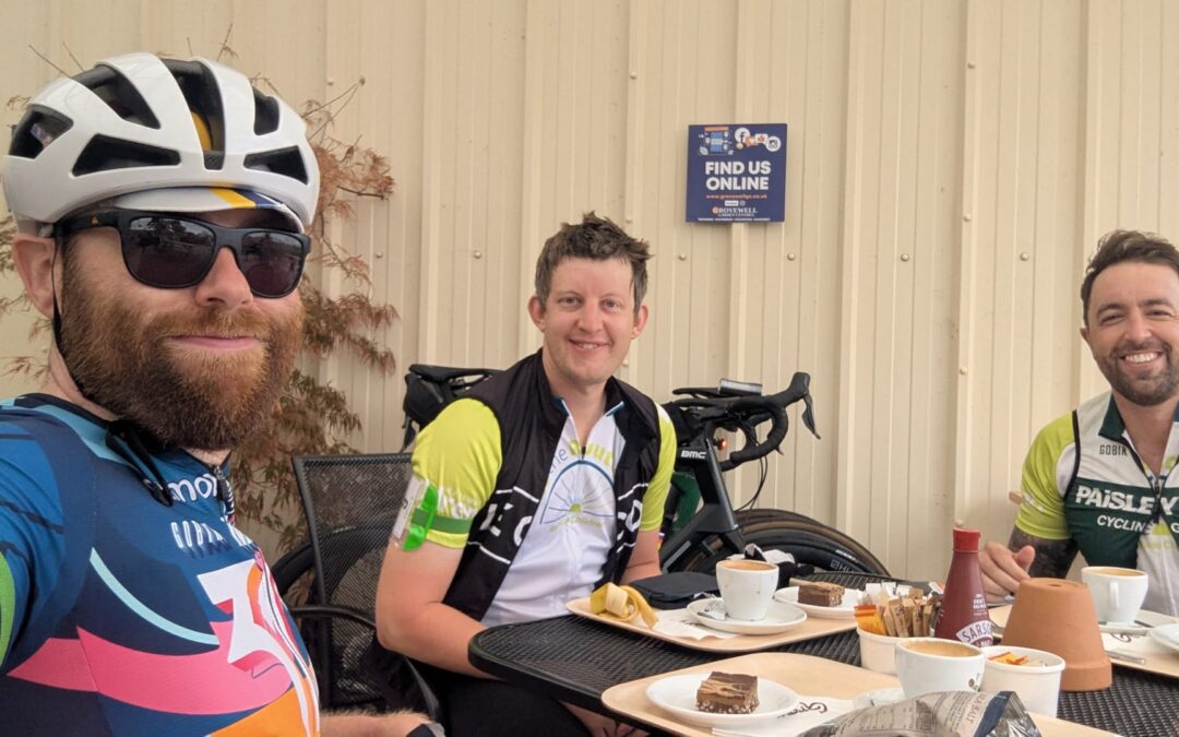 Ride the Route cyclists take a well-earned break at a café during a Railway Children charity bike ride, enjoying refreshments before continuing the challenge.