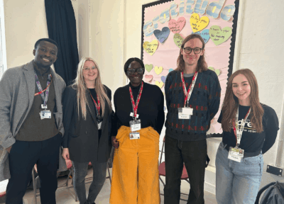 Group photograph of Railway Children staff and school representatives at a primary school in Maida Vale after delivering a rail safety assembly as part of the 200 Seconds of Safety campaign.