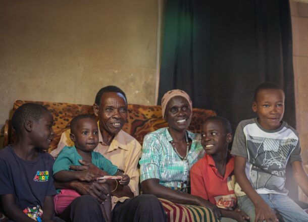 A family in Tanzania with a fit person showing Railway Children's work in Tanzania.